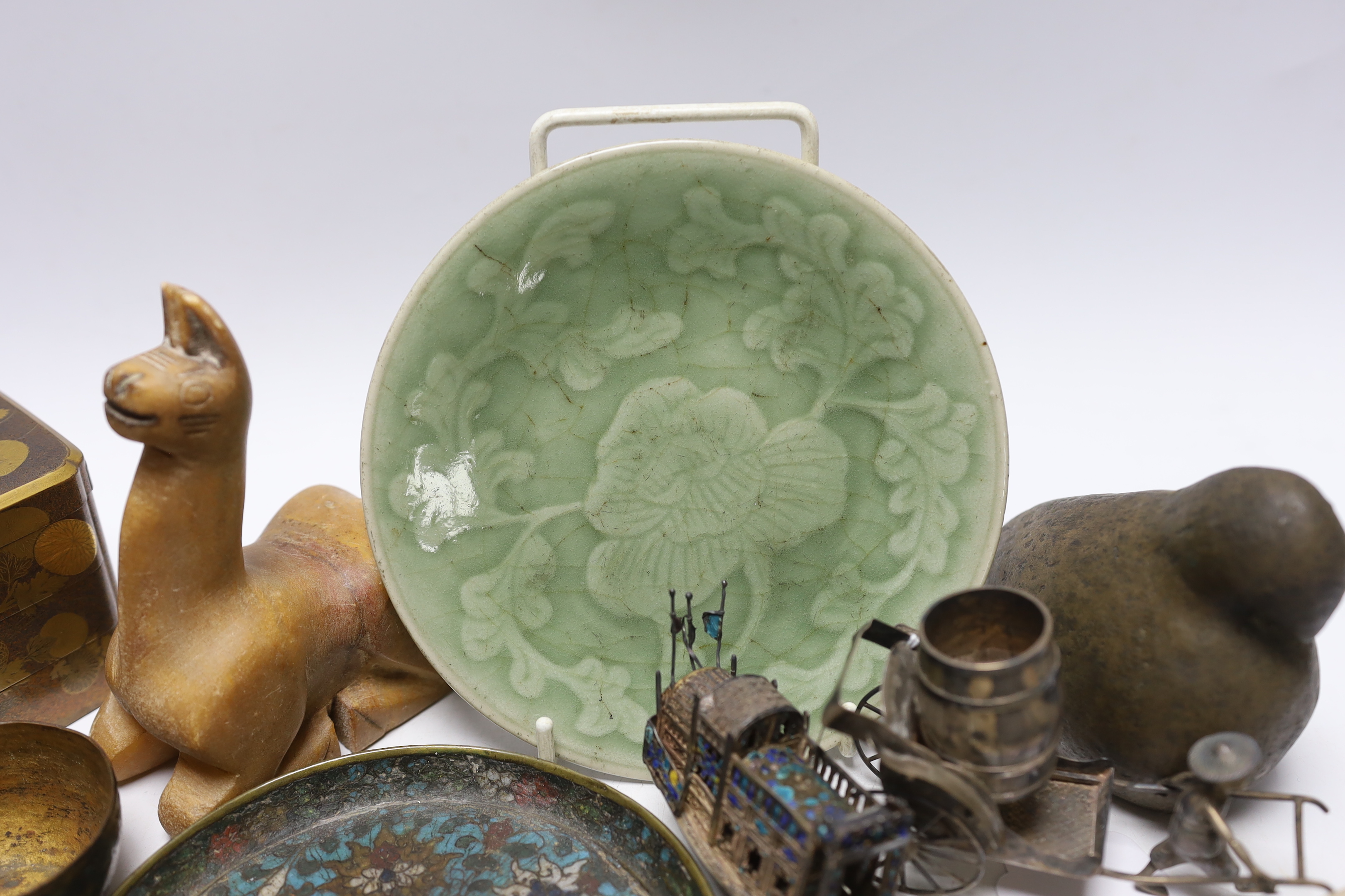 A Japanese lacquer three tier box and enamelled white metal miniature junk, gaming counters and sundries